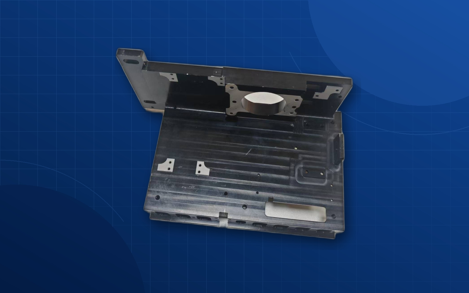 Deep blue background aerospace CNC machined component